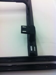 PU-coated Steel mounting brackets for sliding rails. It comes with a T that can be adjusted anywhere on the rail